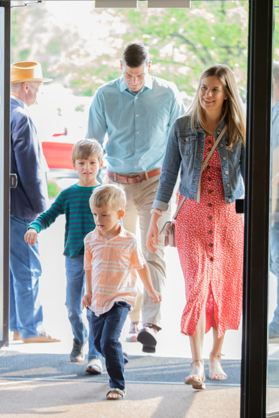 Family coming in door 2 great vertical